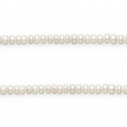 Imperfect freshwater pearls flat round Natural White