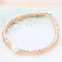 Minimalist flower jewellery with rose beads and daisy flower beads