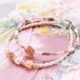 Minimalist flower jewellery with rose beads and daisy flower beads