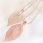 Delicate necklaces decorated with autumn leaf pendants 