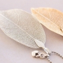 Delicate necklaces decorated with autumn leaf pendants 