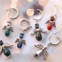 Angels with top faceted drop shaped beads and metal wings