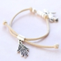 Elastic bracelets and layered necklaces with metal charms