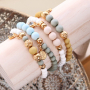 Bracelets and earrings with botanical colours and golden details