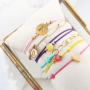 Need some inspiration? It's easy to make trendy bracelets out of elastic cord: