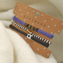 Making the nicest bracelets with stitched elastic ribbon: