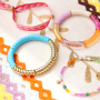 Inspiration for bracelets with acrylic beads, faceted beads and ribbon with text