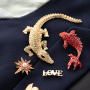 Mix & match with statement brooches