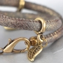 Nice stitched leather with beautiful findings and charms made of Designer Quality metal!