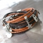 Work with layers like different kinds of round and braided DQ leather