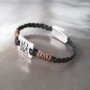 Work with layers like different kinds of round and braided DQ leather
