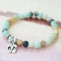 Beautiful semi-precious stone bracelets in soft colours mixed with wooden beads, cork, tassels and DQ metal charms.