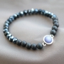 Stylish jewellery with acrylic beads and diverse stringing materials in dark tones like blue and anthracite. 