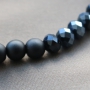 Stylish jewellery with acrylic beads and diverse stringing materials in dark tones like blue and anthracite. 